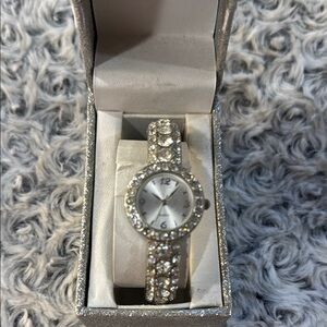 open Metal bracelet Band. Has never been out of box. Might need new batteries.